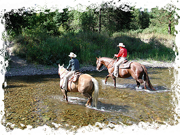 Twin Wranglers cross the Fisher River