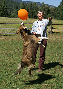 Sage pokes balloon with her nose